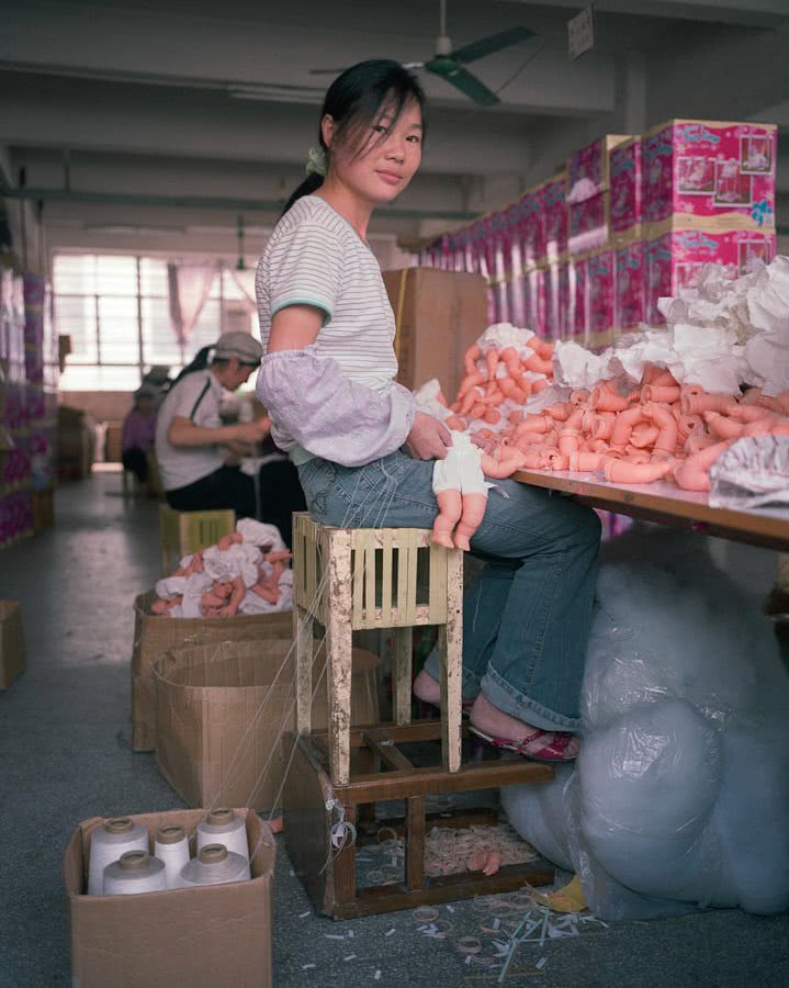 Toy factory worker on stools, China, Michael Wolf