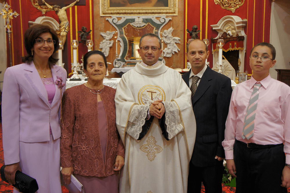 Fr Stephen's with his brother Charles to whom he donated his own kidney, his wife Marthese and their son., and Fr Stephen's mother Michelina